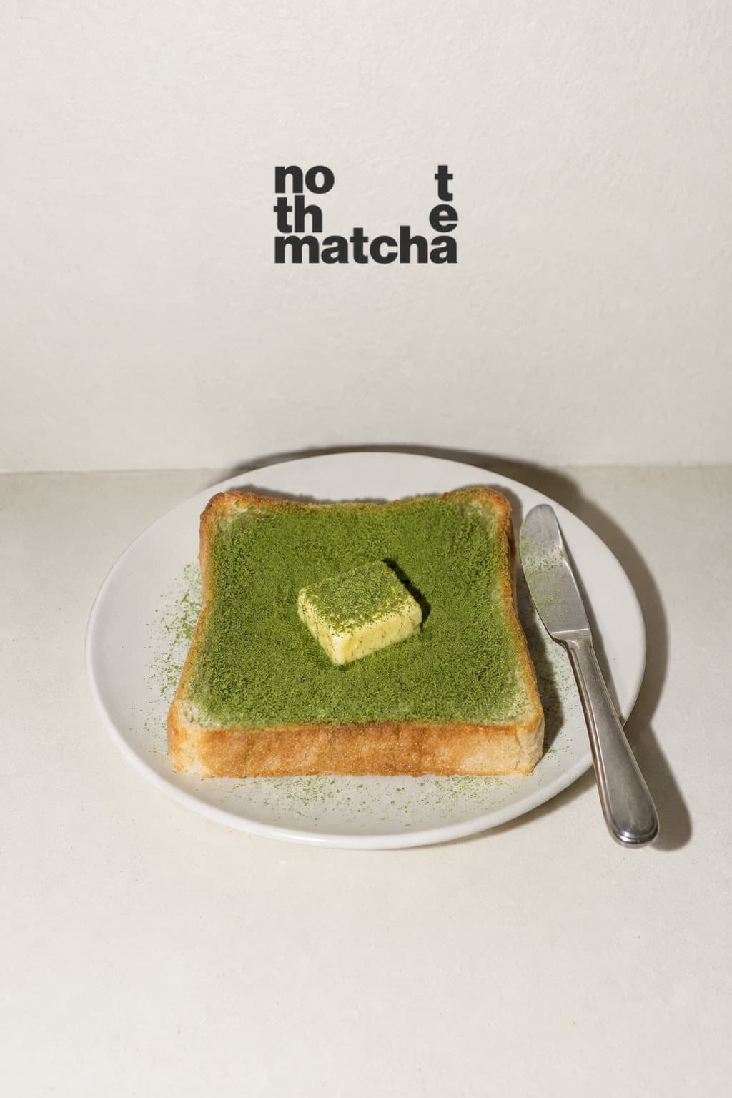 Buttered toast dusted with matcha powder